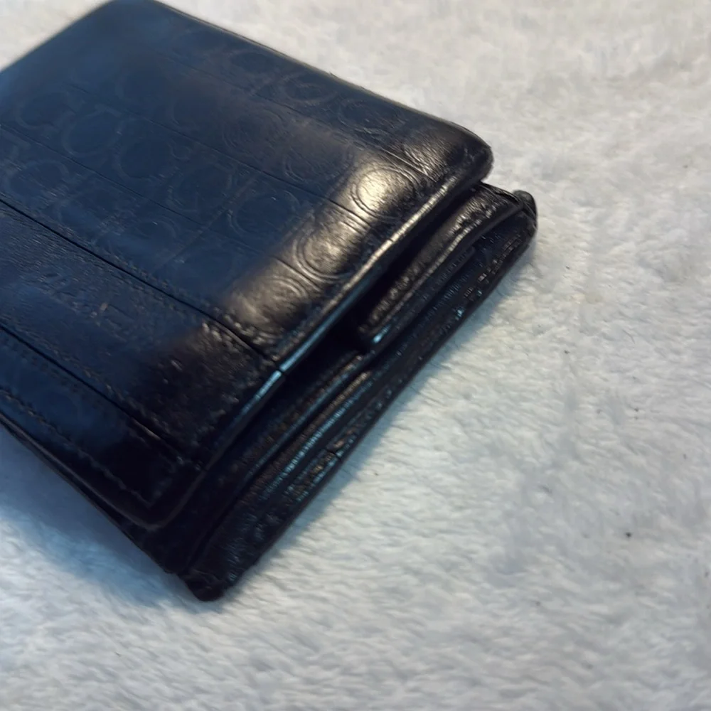 Salvador Ferragamo black bifold wallet.